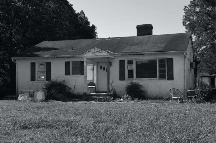 House shown from the outside in need of repairs