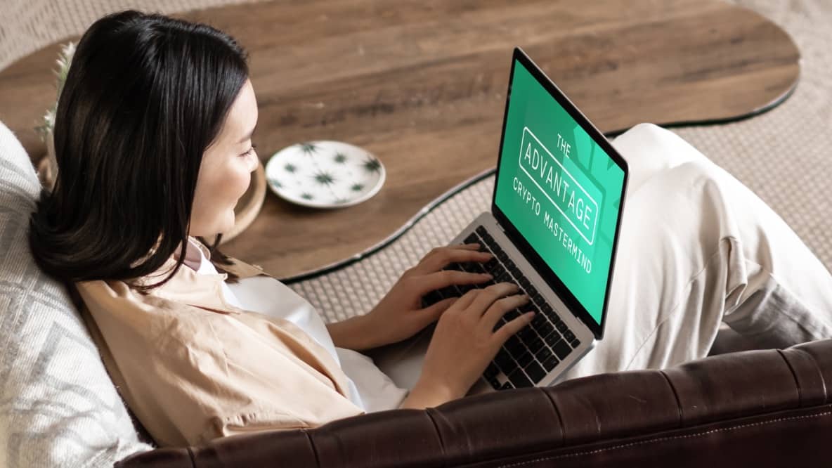 Woman sitting on ouch with laptop